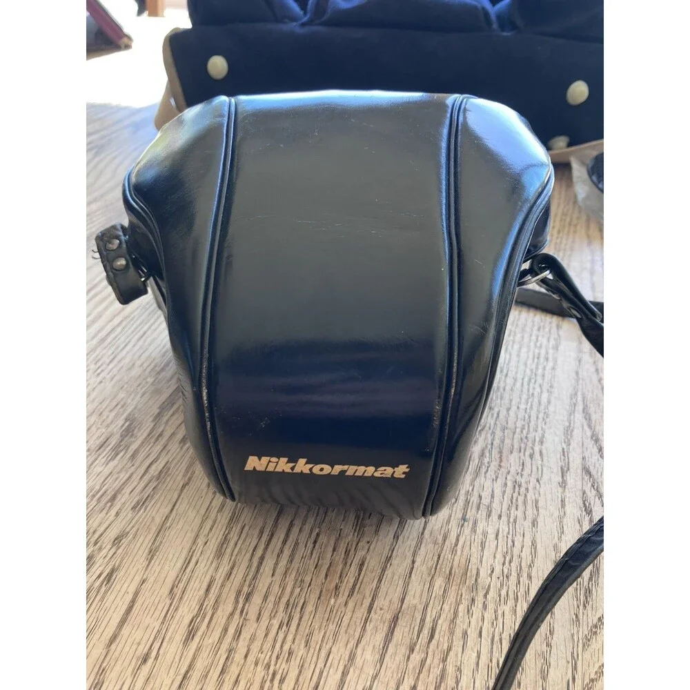 Nikon Nikkormat FTN 35 mm Camera with Additional lens, leather cases, & extras